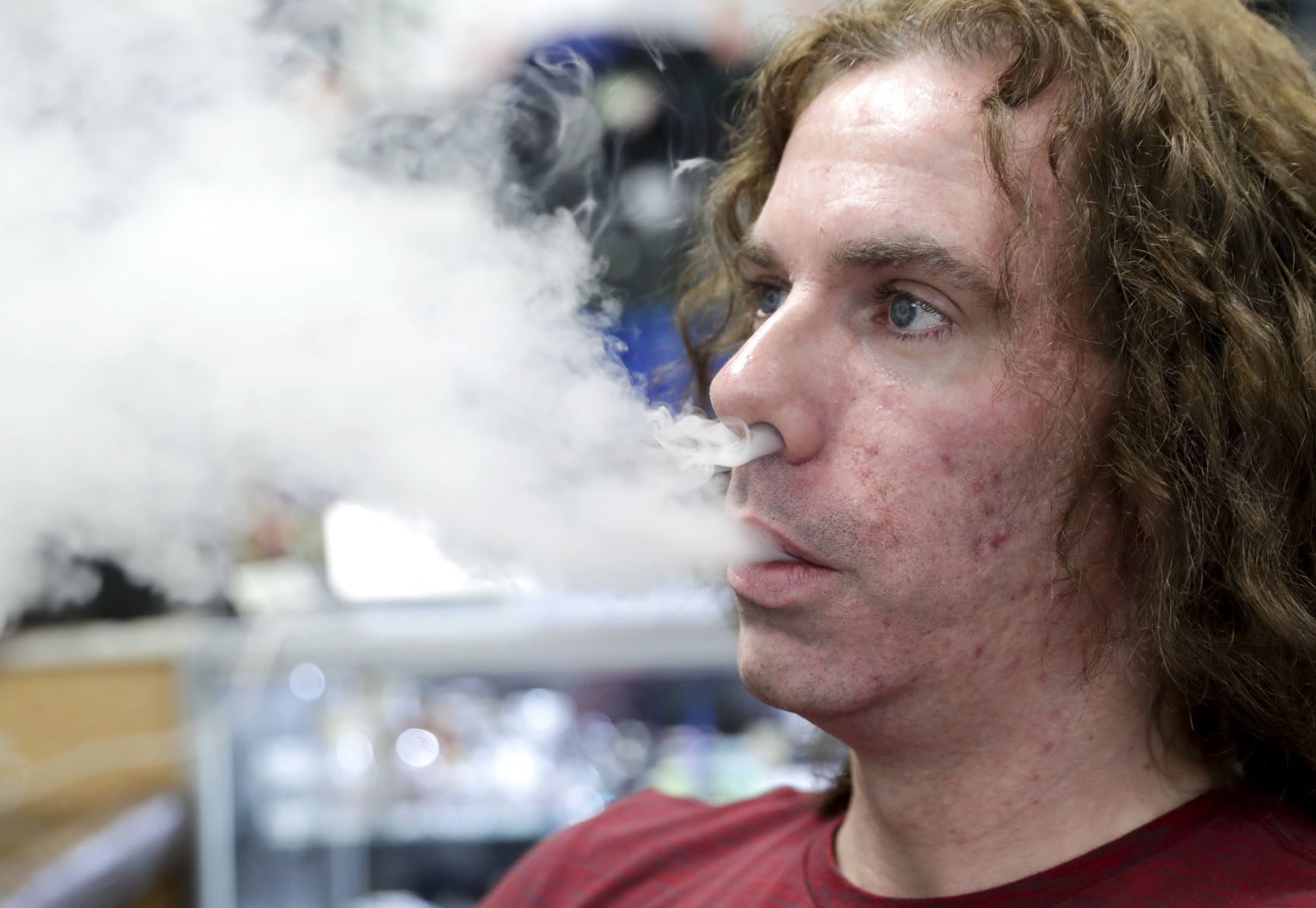 Vape shop owner vaping